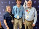 ARRL member Chris Brault, KD8YVJ (center), a student at Saint Louis University's School of Science and Engineering, helped represent Youth on the Air (YOTA) at HamCation. He is an active participant in the ARRL Collegiate Amateur Radio Program (CARP). Brault is seen here with ARRL President Rick Roderick, K5UR (right), and Maxim Society Member Holly Roderick (left).